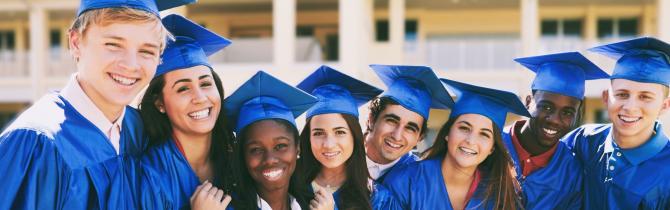 Vision of a Learner Part 2 reg hero - students in blue graduation gowns and caps