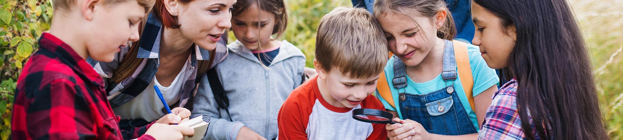 become accredited hero - children with magnifying glass