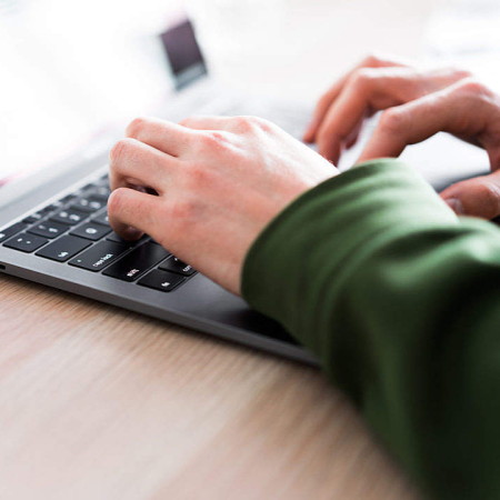 hands of person sending an email