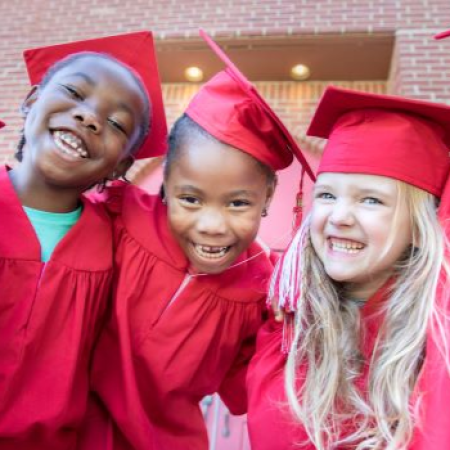 Vision of a Learner - 3 kids in graduation cap and gown